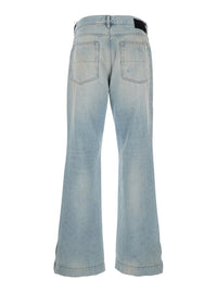 Amiri Men Men's Light Blue Denim Jeans With Ripped Details And Logo Patch On The Back