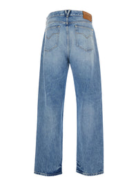 Versace Men Light Blue Jeans With Logo Patch On The Back And Faded Effect In Denim For Men