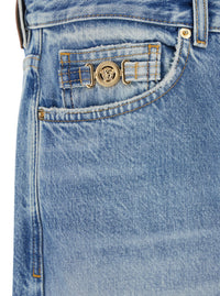 Versace Men Light Blue Jeans With Logo Patch On The Back And Faded Effect In Denim For Men
