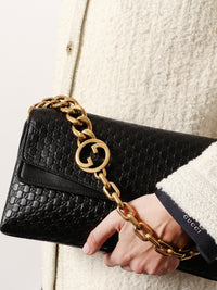 Gucci Women Leather Crossbody Bag With Embossed Gg Motif