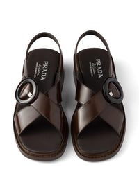 PRADA Brushed Leather Crisscross Band Sandals With Plexiglas Buckle Women