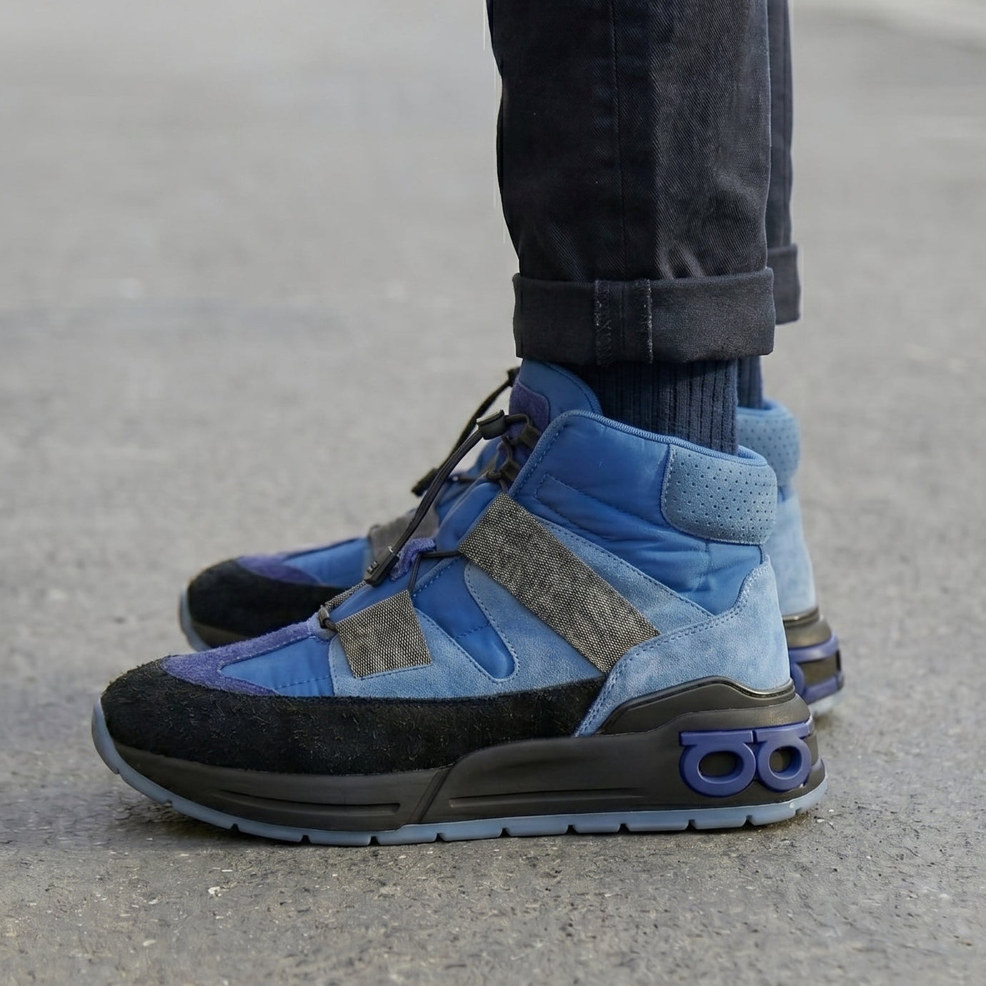 Person wearing Blue Ferragamo Leonida High Top Men's Sneakers on the street.