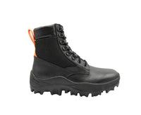 Stylish MCM men's black leather combat boots with reflective patches and vibrant orange pull tabs for a bold, modern look.