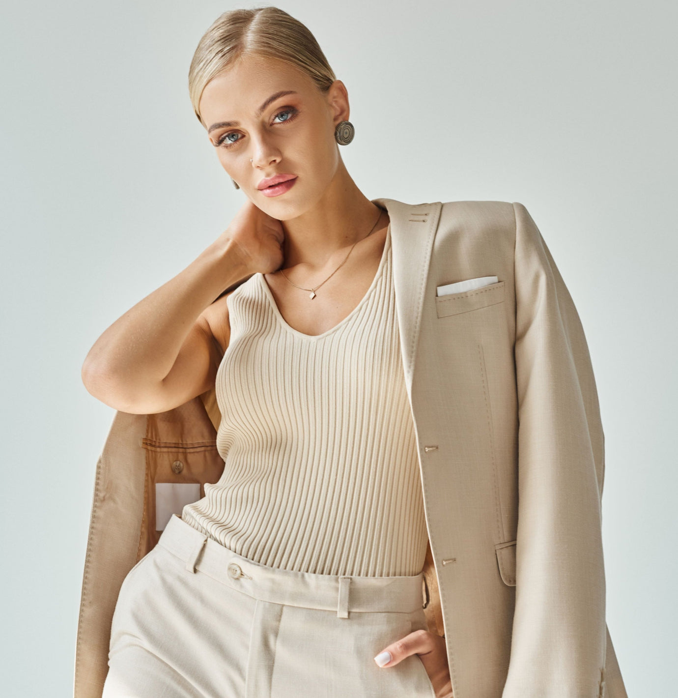 Women wearing a tan blazer